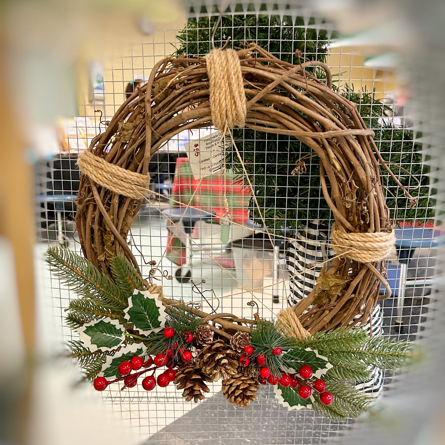 Holly and Pinecone Grapevine Wreath